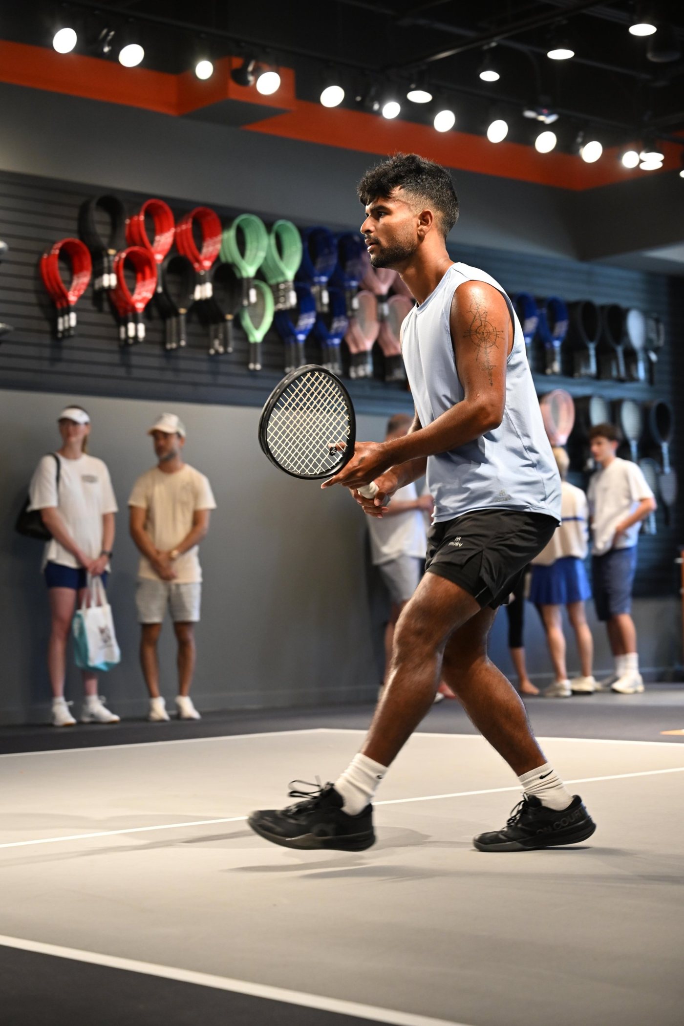 A player ready at the net on the TYPTI store court